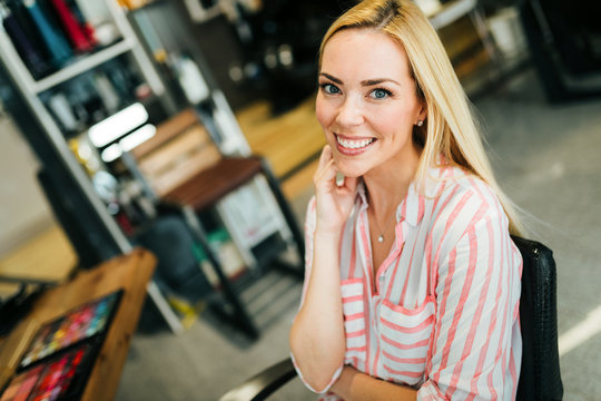 Portrait of a beautiful blonde woman smiling.