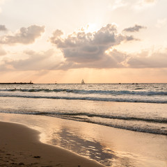 Quiet sunset on the sea. Beach of Tel Baruch, Tel Aviv, Israel.