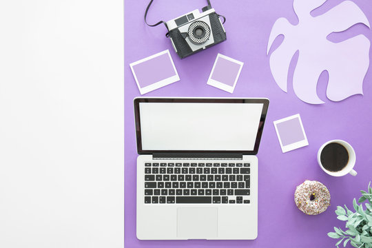 Laptop on purple background