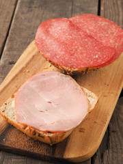 Tasty buns with ham and salami