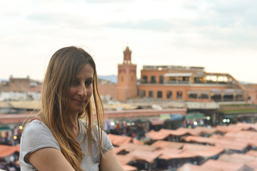 the girl in front of the Jemaa el fna square, Marrakech, Morocco