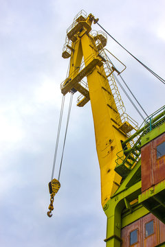 Truck crane boom with hooks and scale weight.