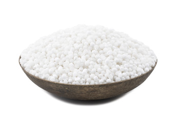 White Sago Pearls in Vintage Bowl Also Know as Sabudana, Tapioca Pearl or Sago Seeds isolated on White Background