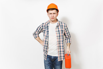 Young concerned man in casual clothes and protective hardhat holding case with instruments or toolbox isolated on white background. Instruments for renovation apartment room. Repair home concept.