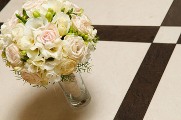 Beautiful wedding bouquet of white and pink roses in the vase.