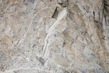 Marble in natural form. Texture of marble rock close up. Background image of beautiful stone.