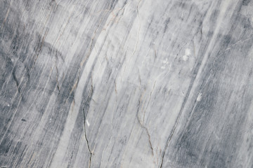 Marble in natural form. Texture of marble rock close up. Background image of beautiful stone.