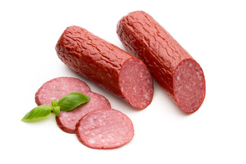 Salami smoked sausage, basil leaves on white background cutout.