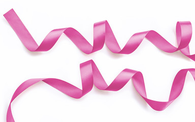 Pink rose fuchsia color satin ribbon for  valentines' day decoration isolated on white background
