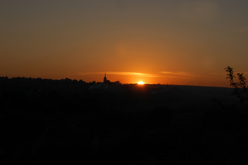 Sunset over the mountain. Church on the mountain. Landscape. Sunset. Night.