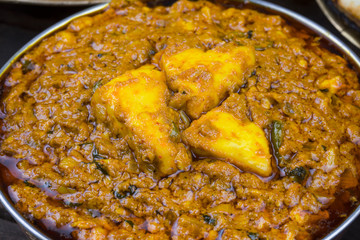 Indian Vegetarian Cuisine Kadai Paneer Also Know as Kadhai Paneer or Karahi Paneer is an Indian Dish of Marinated Paneer Cheese Served in a Spiced Gravy on Vintage Wooden Background