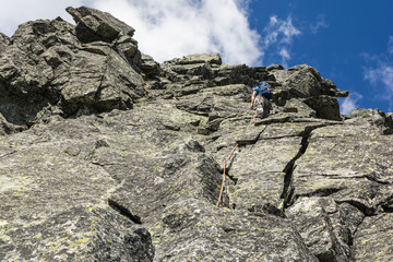 Climbing in the mountains. Looking for a good further variant of the climbing route through the climber.