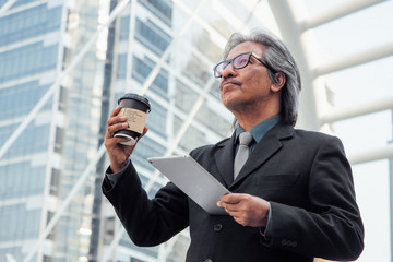 Close up business man drinking a coffe cup before working.