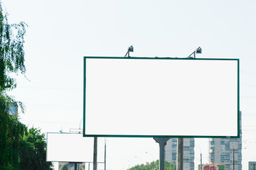 Billboard, billboard, canvas billboard, layout on the background of the city. The concept of outdoor advertising, marketing, sales. mockup