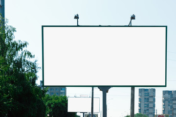 Billboard, billboard, canvas billboard, layout on the background of the city. The concept of outdoor advertising, marketing, sales. mockup