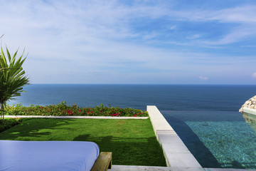Sunny view of Karma Beach from tropical infinity pool