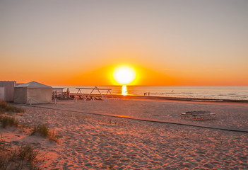 Baltic sea in spring sunset warm light. Sandy beach in Jurmala, Latvia, East Europe.