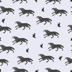 Running wolves and flying crows. Seamless black and white pattern. Design for printing on fabric or paper.
