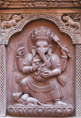 Fototapeta na wymiar Wooden carving with Ganesha Hindu God at the palace in Patan, Nepal