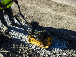 repair of the road on a Sunny day