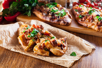 Traditional Turkish pide with meat and vegetables