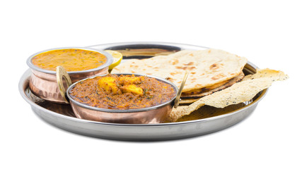 Indian Traditional Thali Food Kadai Paneer Served With Dal Makhani, Tandoori Roti or Papad isolated on White Background