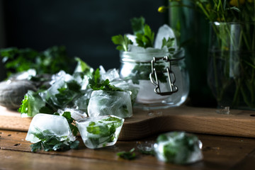 Ice cubes with frozen herbs