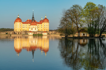 Castle Moritzburg in Saxony near Dresden. Pond reflection. Springtime. Germany.