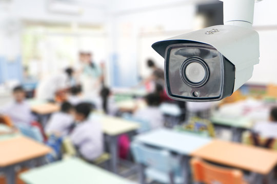 CCTV Security monitoring student in classroom at school.Security camera surveillance for watching and protect group of children while studying.