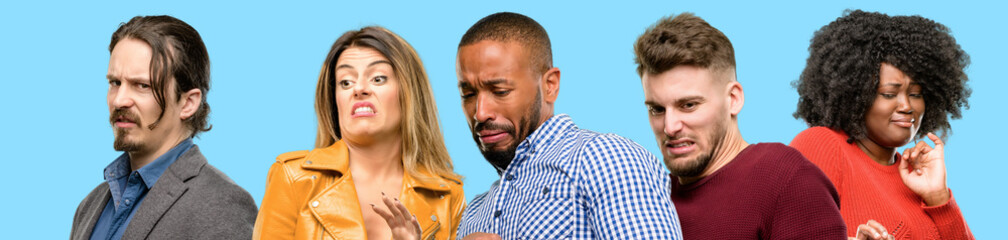 Group of mixed people, women and men disgusted and angry, keeping hands in stop gesture, as a...