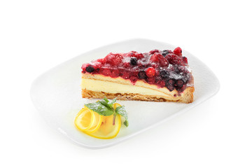 cake with forest berries on white plate