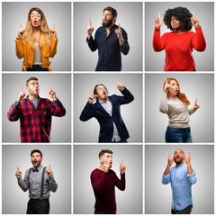 Obraz premium Group of mixed people, women and men happy and surprised cheering expressing wow gesture pointing up