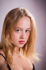 Naklejka premium Young girl with beautiful eyes and red lips.