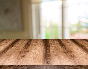 Wooden empty table board in front of blurred background. Can be used for display or montage any product. Mock up for display your product.