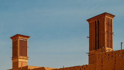 Windcatcher towers is a traditional Persian architectural element to create natural ventilation in buildings, old city Yazd Iran