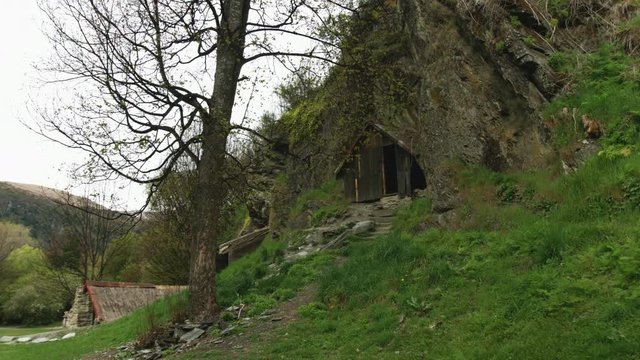 Old mining town with historic huts in New Zealand mountains