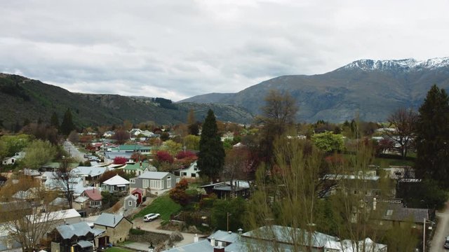 Wide drone shot revealing Arrowtown, New Zealand