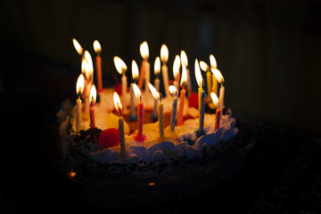 Cake with burning candles