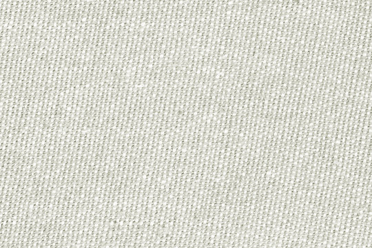 Old white linen texture with visible fibers.Canvas background 