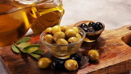 Foto op Plexiglas Bottle virgin olive oil and oil in a bowl with some olives © beats_