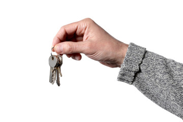 caucasian man's hand holding keys isolated on white background with clipping path
