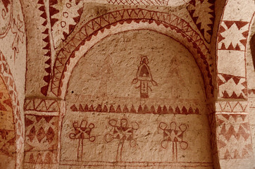 Murals in ancient Christian cave church with red geometrical ornaments ,Cappadocia,Turkey