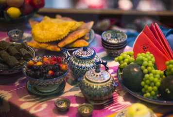 Home tableware in Russian traditional Gzhel style. Closeup. Gzhel - Russian folk craft of ceramics and production porcelain and a kind of Russian folk painting. Blurred focus