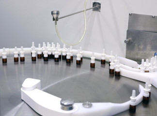 The production line of the medicine. Filling interferon in bottl
