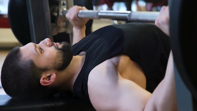 sport bodybuilding gym workout. athlete training lifestyle. health fitness strong body concept. man doing benchpress exercises