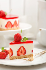 Cold cheesecake with strawberry and strawberry jelly.