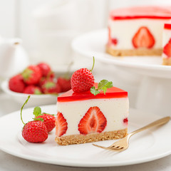 Cold cheesecake with strawberry and strawberry jelly.