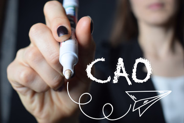 The businessman writes an inscription with a white marker:CAO