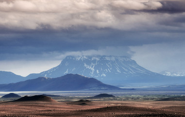 Beautiful landscape of mountain in Iceland with volcano in the background