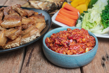 Close up (Nam prik ong) Northern Thai Meat and Tomato Spicy Dip in a White Cup.